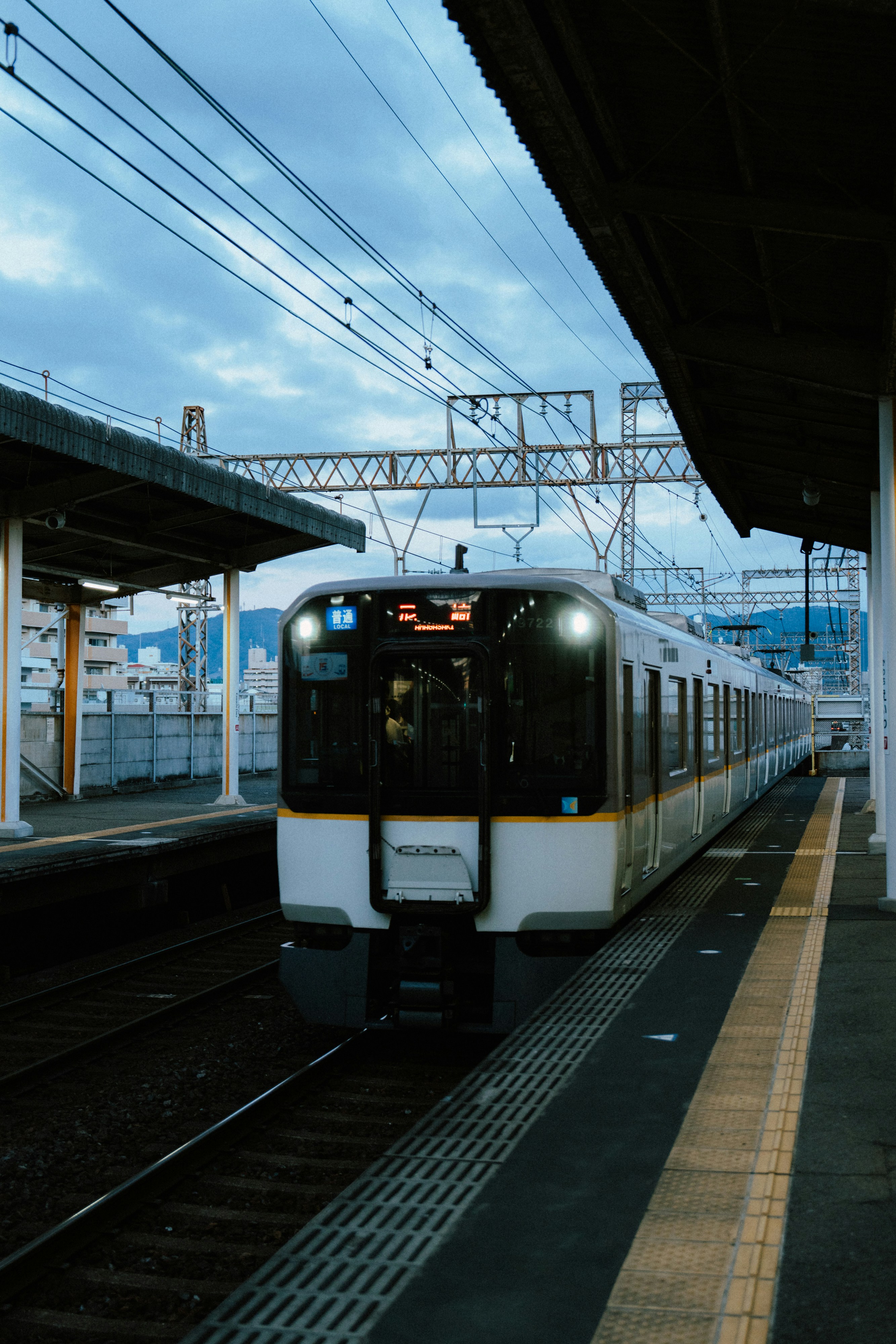 A city bus driving on a street in Kyoto